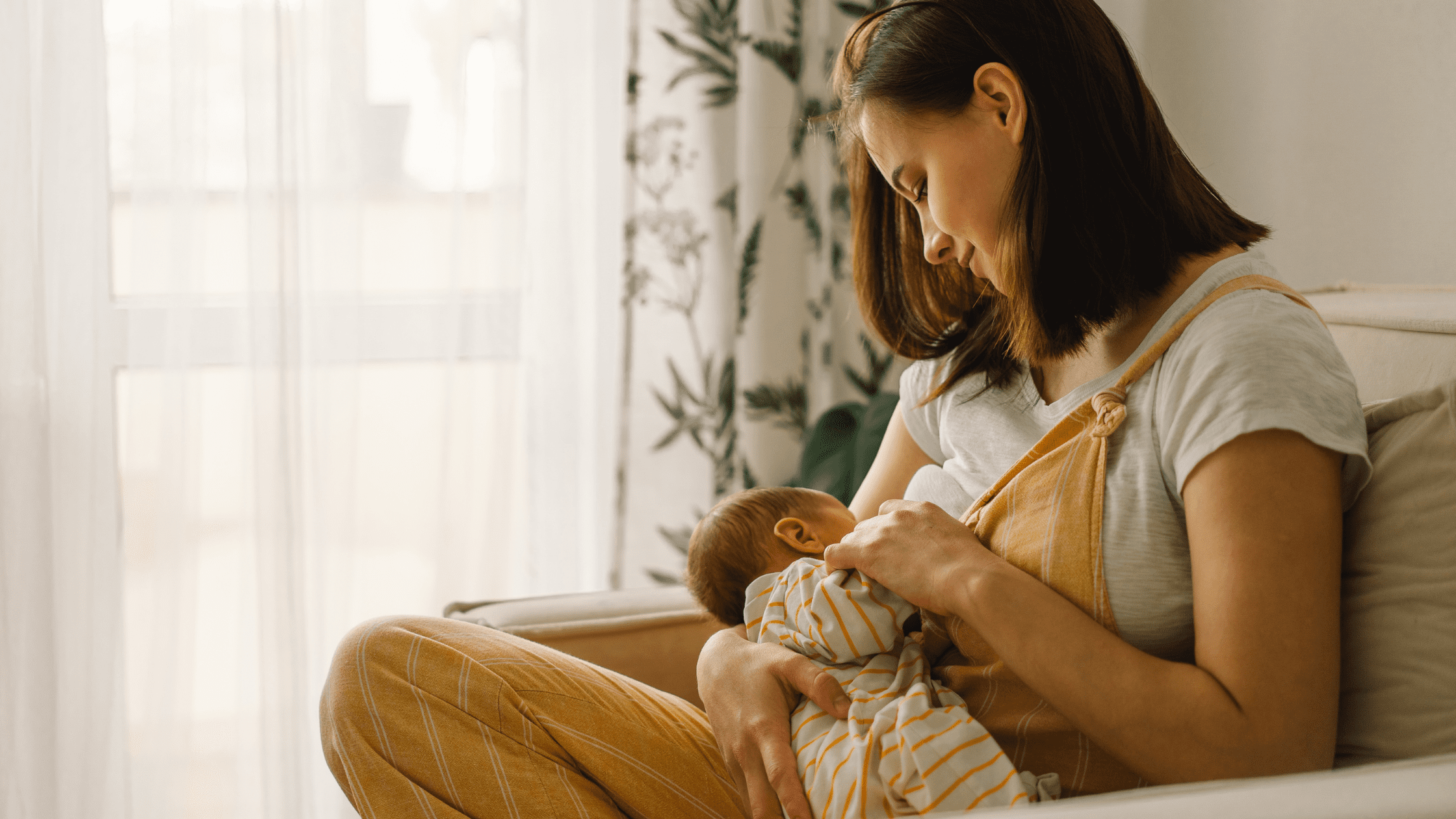 a mother breastfeeding her baby